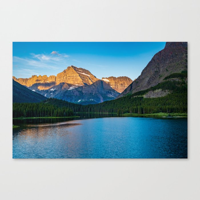 Dawn breaks over Mount Wilbur at Swiftcurrent Lake, Glacier National Park  Montana Canvas Print