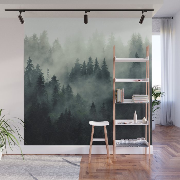Misty pine forest on the mountain slope in a nature reserve Wall Mural