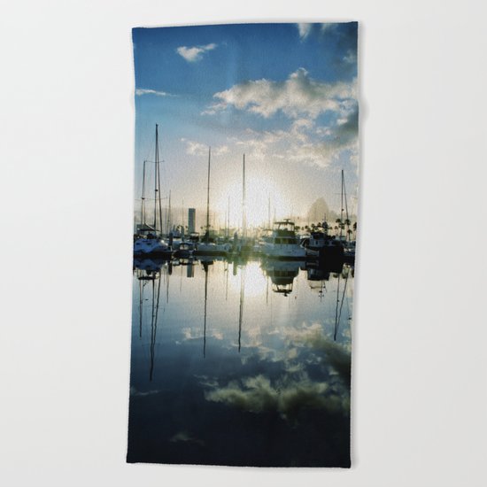 mirrored marina Beach Towel
