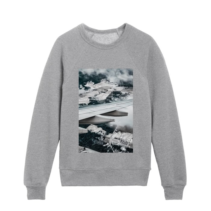 Winter snow covered forest as seen from the window of airplane over Finland Kids Crewneck