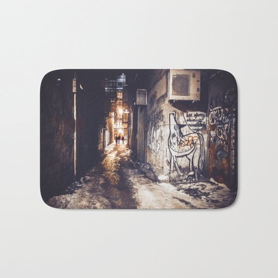 Lower East Side - Midnight Warmth on a Snowy Night Bath Mat