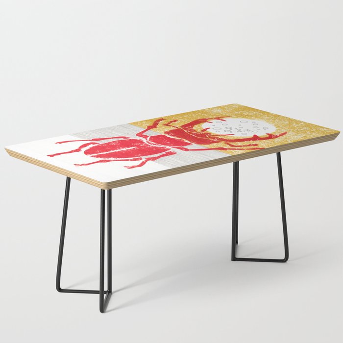 Red stag facing a golden sky Coffee Table