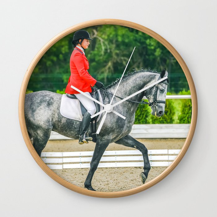 Beautiful girl riding a gray horse Wall Clock