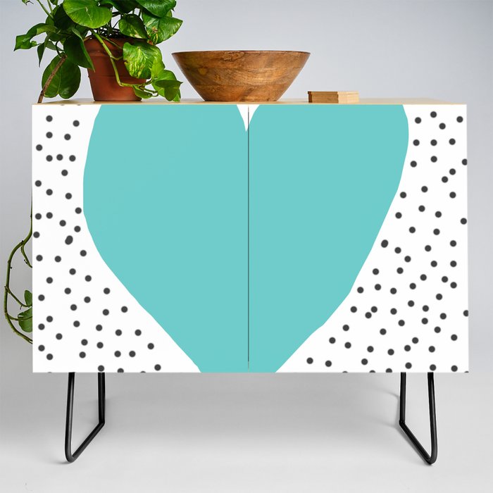 Turquoise heart with grey dots around Credenza