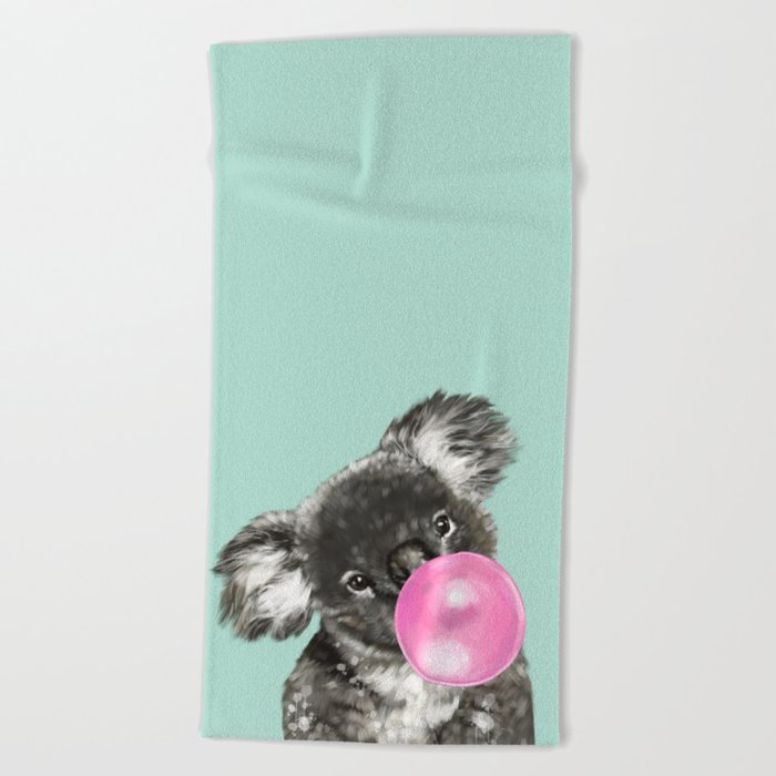 Playful Koala Bear with Bubble Gum in Green Beach Towel