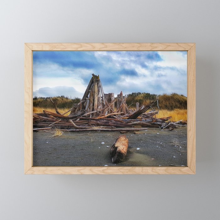 Driftwood by the ocean Framed Mini Art Print