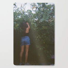 girl in a garden Cutting Board