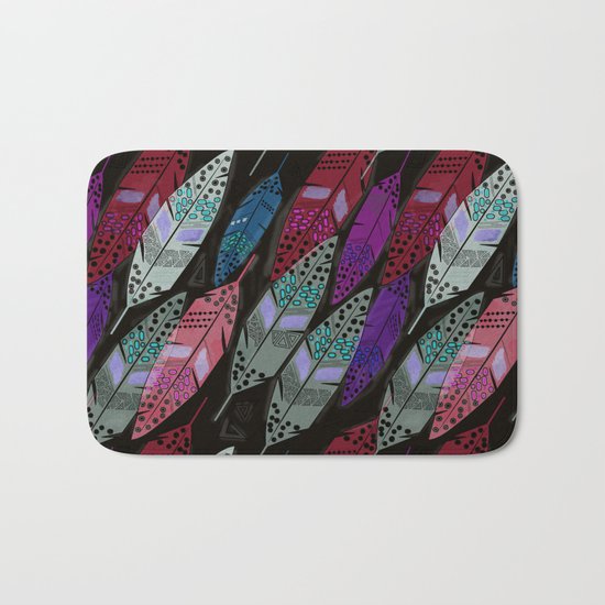 Multi colored feathers on black background . Bath Mat