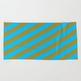 [ Thumbnail: Dark Goldenrod and Deep Sky Blue Colored Striped/Lined Pattern Beach Towel ]