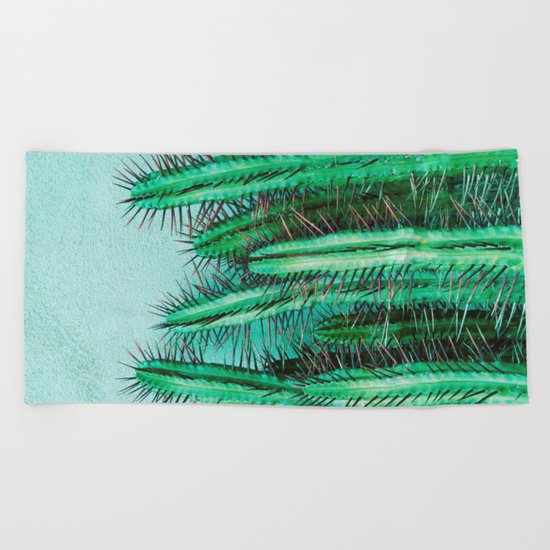 A prickly cactus on concrete Beach Towel