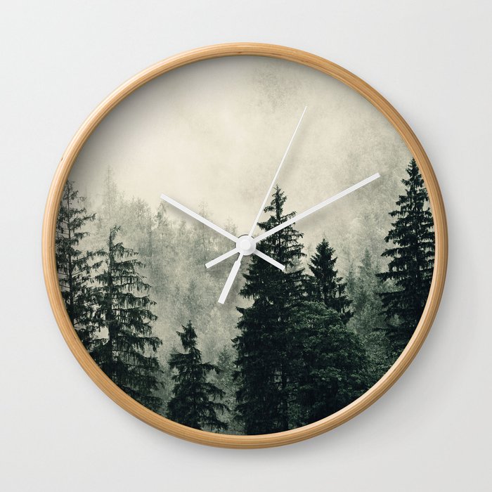 Thick pine forest in the descending mist Wall Clock