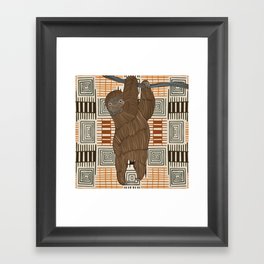 Cute smiling sloth hanging on tree branch with a Tan and brown patterned background Framed Art Print