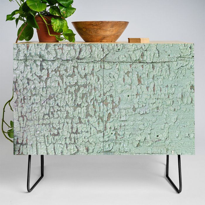 Part of wood with peeled green paint, abstract texture Credenza