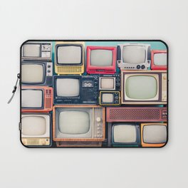 Retro TV receivers set from circa 60s, 70s and 80s of XX century, old wooden television stand with amplifier front mint blue wall background. Broadcasting, news concept. Vintage style filtered photo Laptop Sleeve