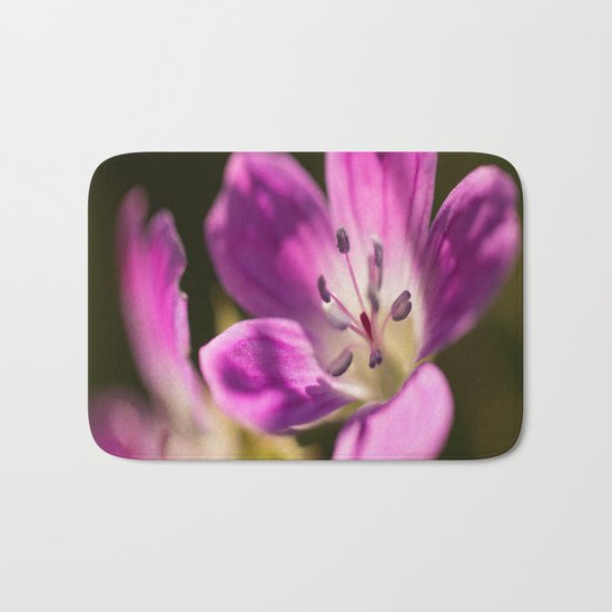 Purple glow in forest Bath Mat