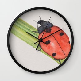 Ladybird on a blade of grass Wall Clock
