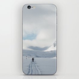 A lonely skier in the wild winter Lapland iPhone Skin