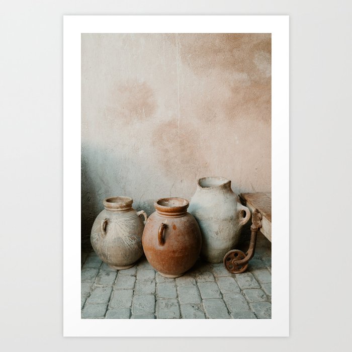 Antique clay jugs standing on a Marrakesh street Art Print