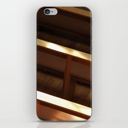 A high angle shot of church pews with a sunlight iPhone Skin