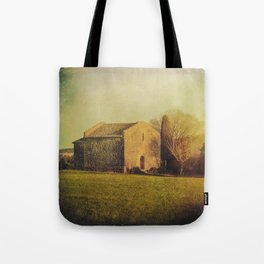 A cute small stone house without windows Tote Bag
