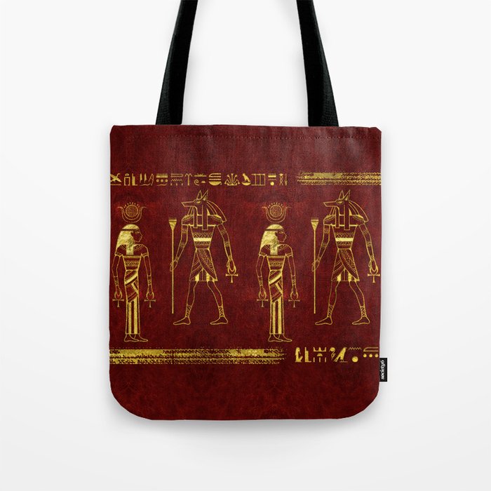 Golden Egyptian Gods and hieroglyphics on red leather Tote Bag