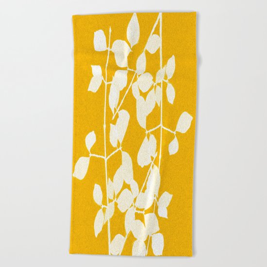 white branch on golden tone Beach Towel