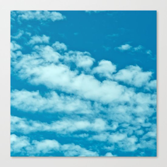 Beautiful blue sky and fluffy clouds Canvas Print