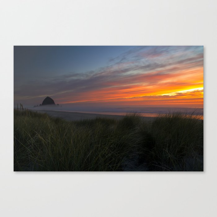 Sunset Over Haystack Rock And The Pacific Ocean At Cannon Beach