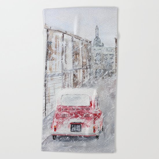 Snowfall and little red car Beach Towel