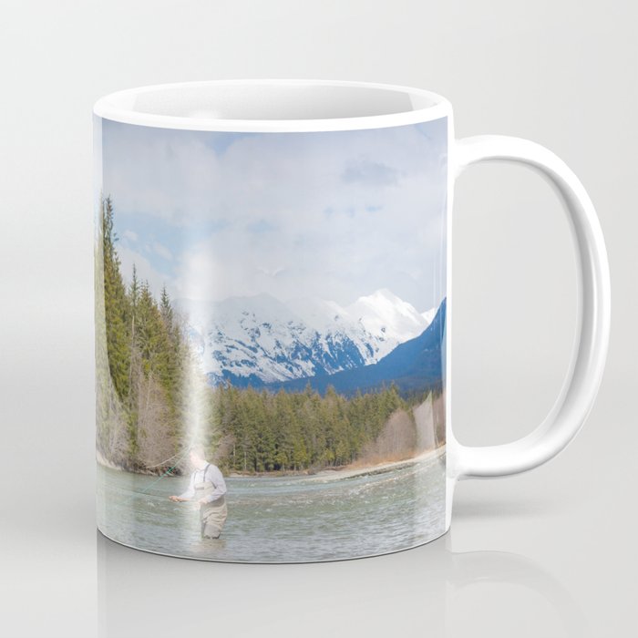A fisherman spey casting on a mountain river in spring, in British Columbia, Canada Coffee Mug