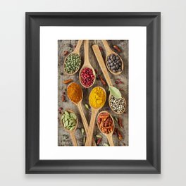 Colorful spices in wooden spoons Framed Art Print
