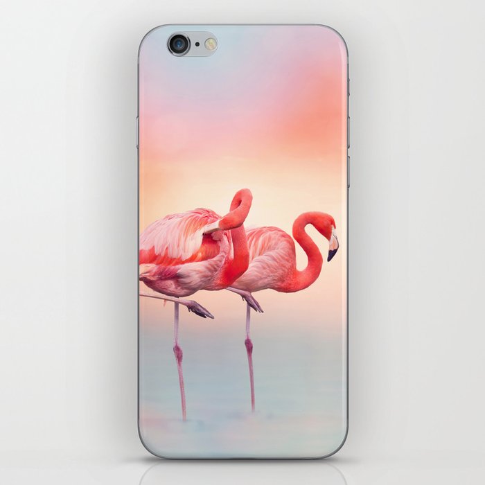 Two Pink flamingos in the water at sunset iPhone Skin