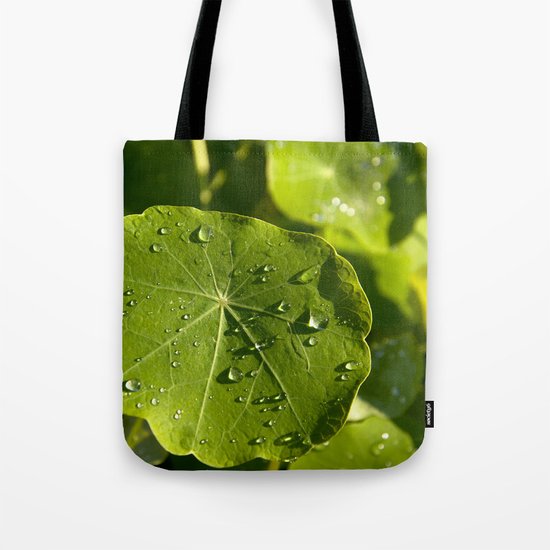 Rain drips on a nasturtium leaf Tote Bag