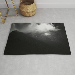 The raven above mountains Rug