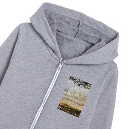 Cows in a grassland at an early winter morning Kids Zip Hoodie