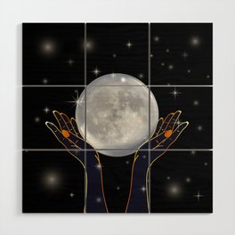 Womans hands holding the moon on a starry night Wood Wall Art