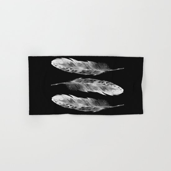 Three feathers on black background Hand & Bath Towel