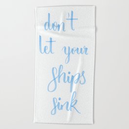 simple lettering in baby-blue "don't let your ships sink" (Fandom / OTP) Beach Towel