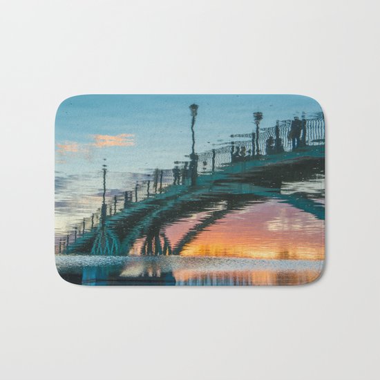 the reflection of the pedestrian bridge Bath Mat