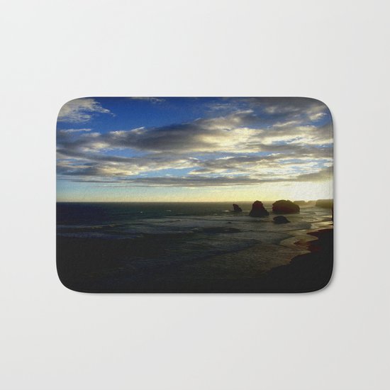 Clouds circling the Twelve Apostles Bath Mat