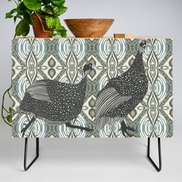 Guinea fowl from the African savannah walking on a patterned background Credenza