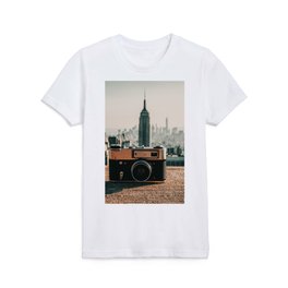 Vintage camera and the Manhattan skyline in New York City Kids T Shirt