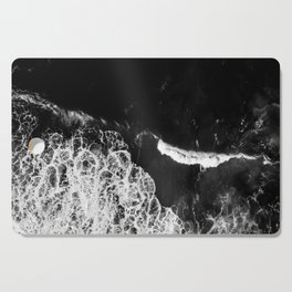 /// Never Alone /// Black and white drone aerial photograph of a dark and moody ocean Cutting Board