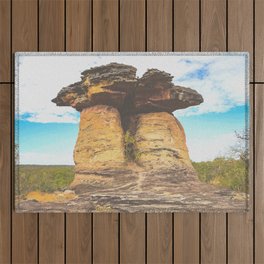 Weird-shaped couple rock formation on vast stone land Outdoor Rug