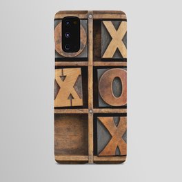 tic-tac-toe or noughts and crosses game - vintage letterpress ing block X and O in wooden grunge typesetter box with dividers Android Case