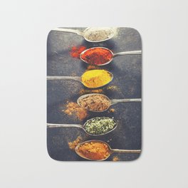 Colorful spices in metal spoons Badematte
