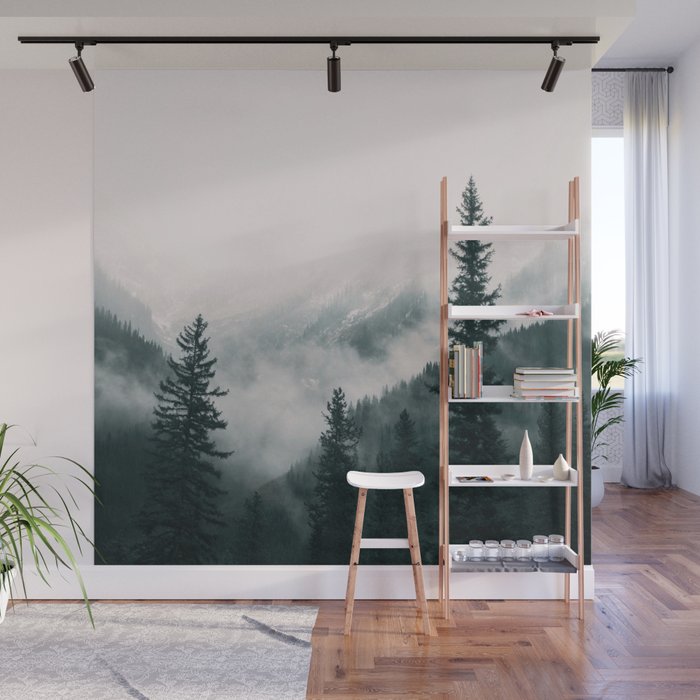 Forest mist beneath the mountain peaks Wall Mural