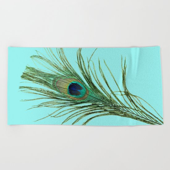 Peacock Feather on Blue Background Beach Towel