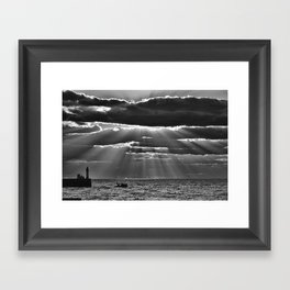 Rays of sun and lighthouse sun through clouds seascape coastal portrait black and white photograph - photography - photographs Framed Art Print