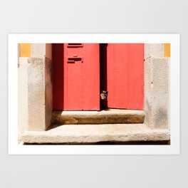 Peeping cat behind a red door - travel photography Art Print